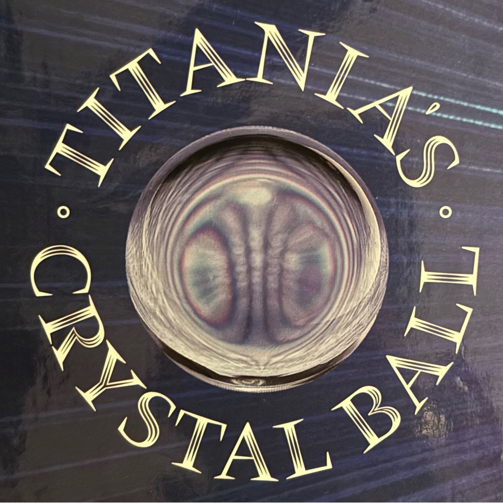 Titania’s authentic crystal ball with stand and guidebook in original box